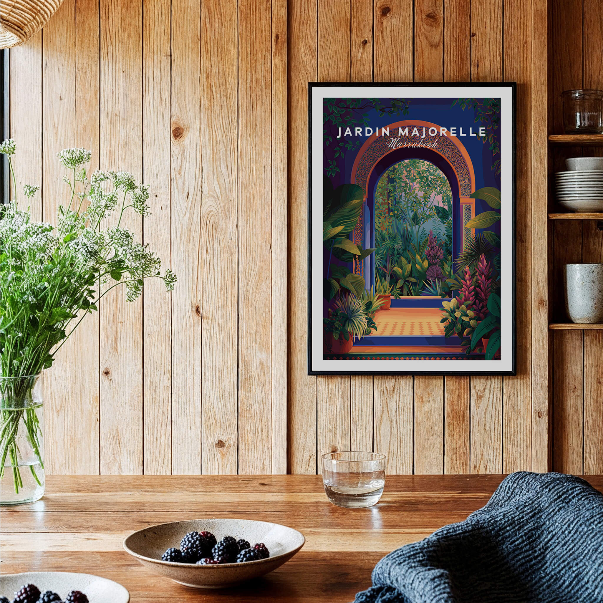 Jardim Majorelle Marrakesh Travel Poster | Lush Tropical Garden Wall Art Print displayed on wooden wall with plants.