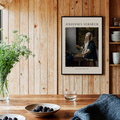 Johannes Vermeer Woman Holding a Balance 1662 Dutch Baroque Art Print Poster displayed in a cozy kitchen setting.