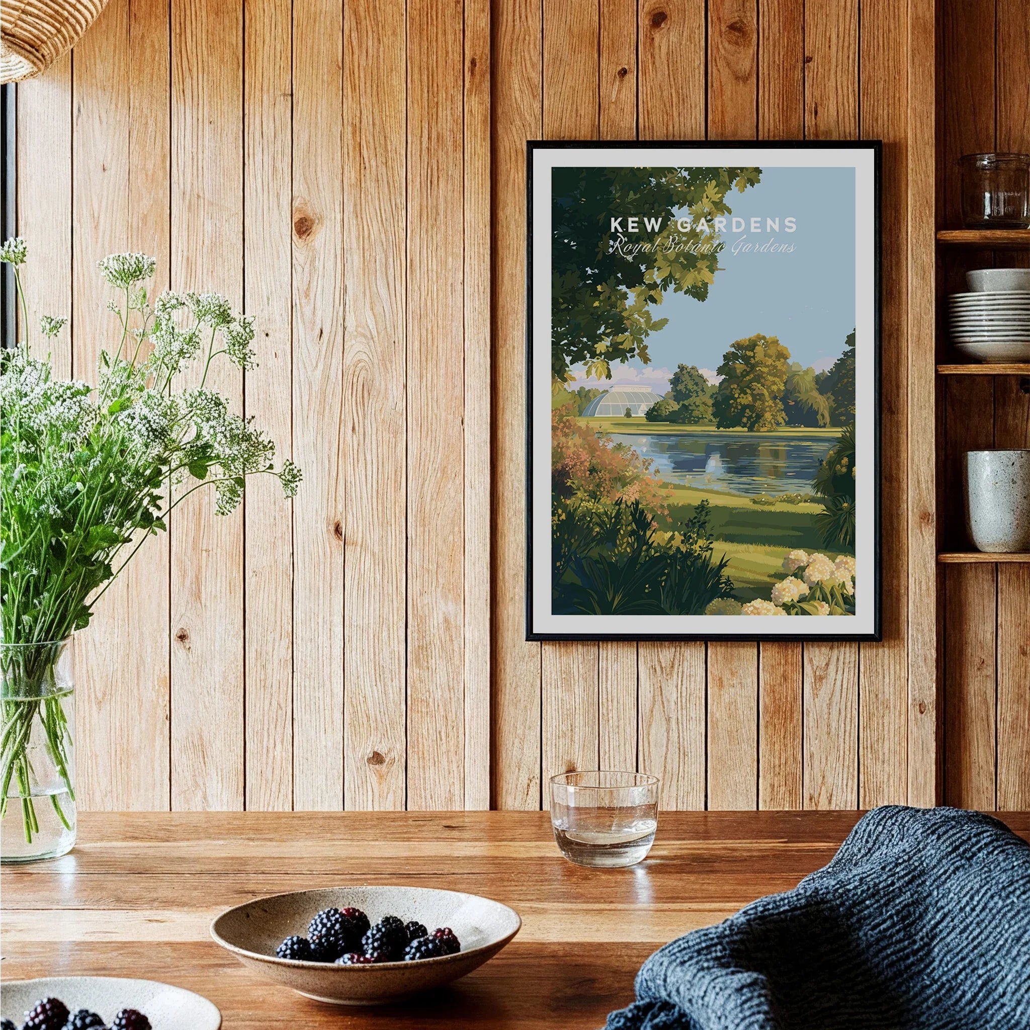 Framed Kew Gardens art print in a rustic kitchen with wooden wall and fresh flowers