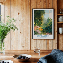 Kew Gardens art print with botanical illustration in black frame on wood kitchen wall.