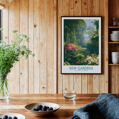 Framed Kew Gardens travel art print hanging in a rustic kitchen with wooden walls