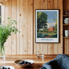Framed Kew Palace London travel poster art print in rustic kitchen setting with wood walls.
