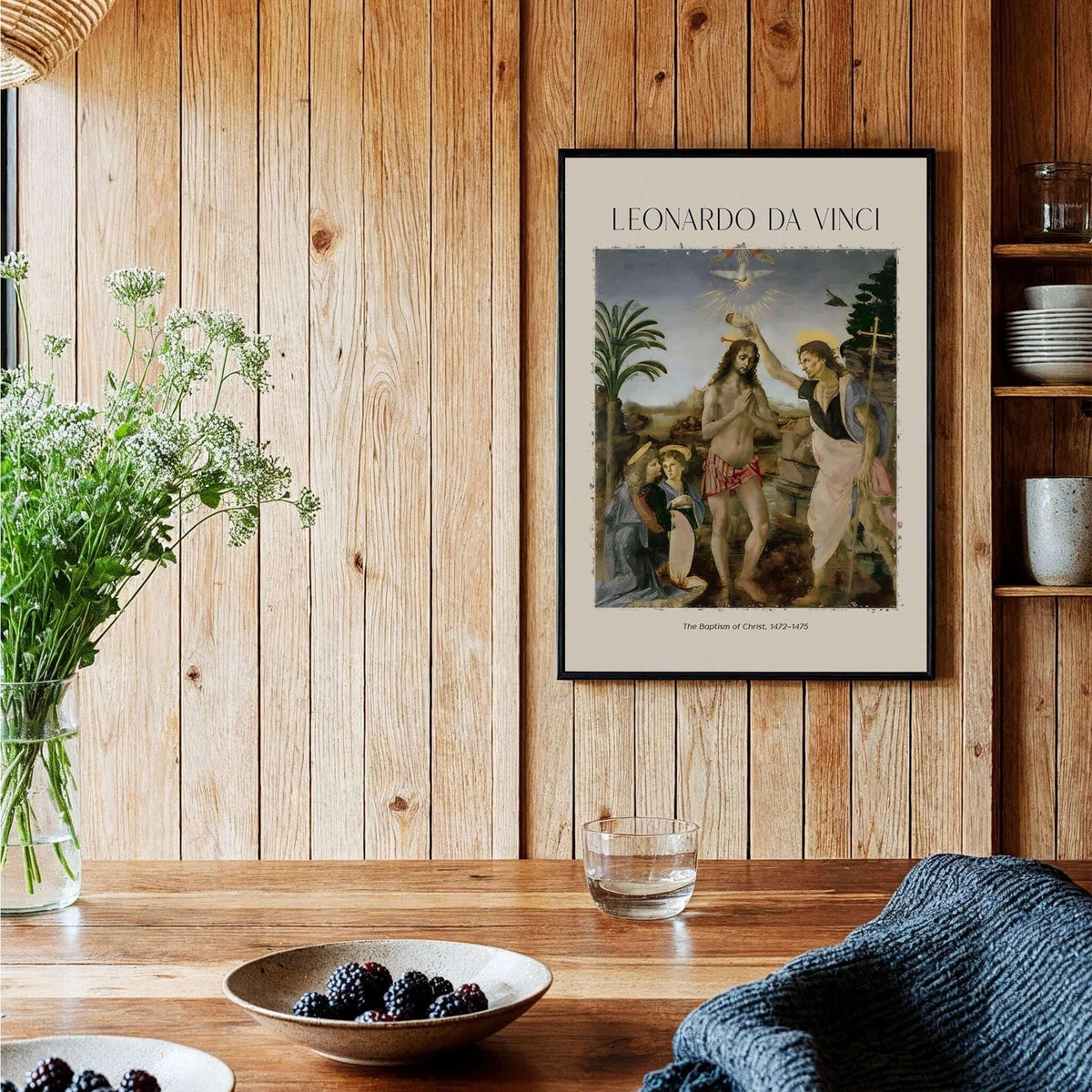 Leonardo da Vinci Art Print The Baptism of Christ 1470s displayed in a stylish interior setting with wooden decor.