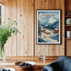 Framed Les Menuires France travel art print in rustic kitchen with wood panel walls