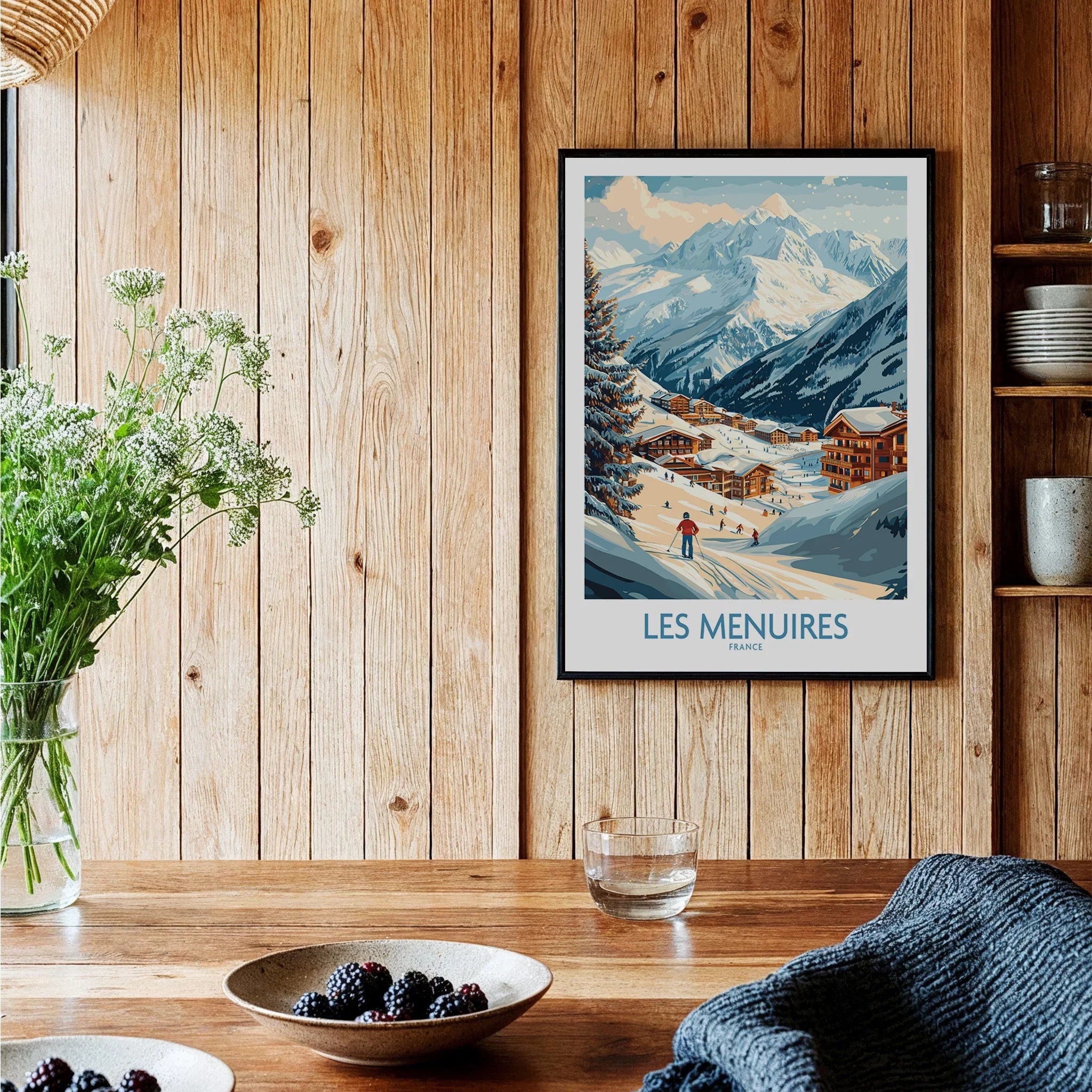 Framed Les Menuires France travel poster on wood kitchen wall, cozy rustic decor