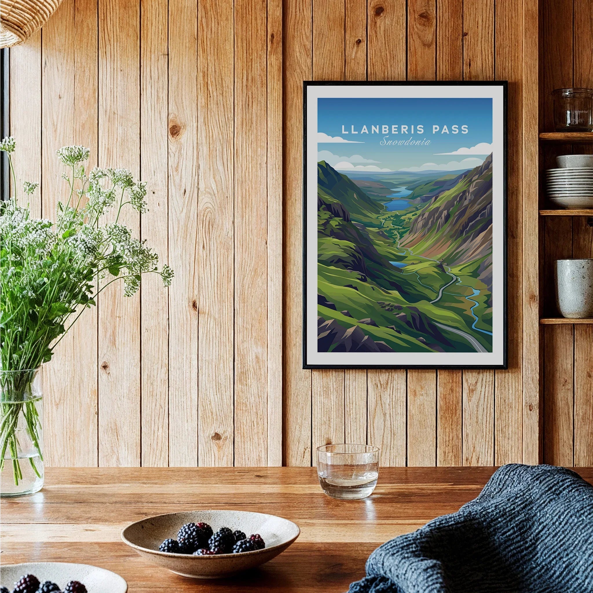 Llanberis Pass travel art print in black frame on wooden kitchen wall, rustic home decor