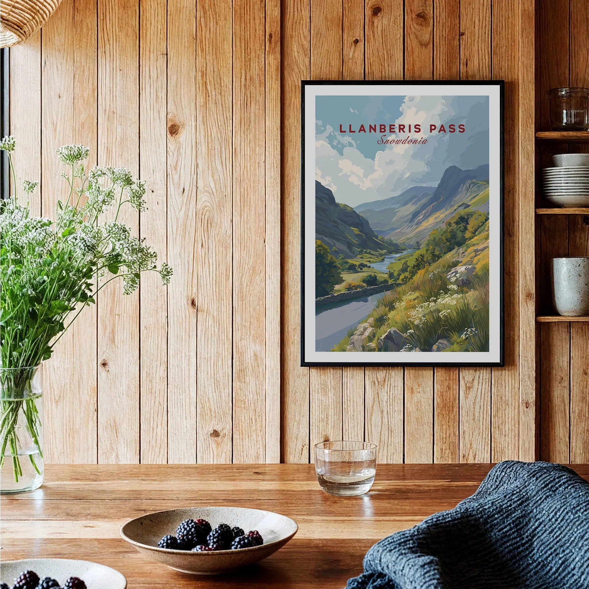 Llanberis Pass travel art print in black frame on wooden kitchen wall, cozy decor setting