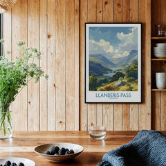 Llanberis Pass travel poster in black frame on wooden kitchen wall with rustic decor