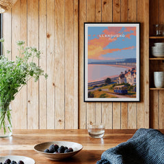 Framed Llandudno Wales travel poster art print in a cozy modern kitchen setting