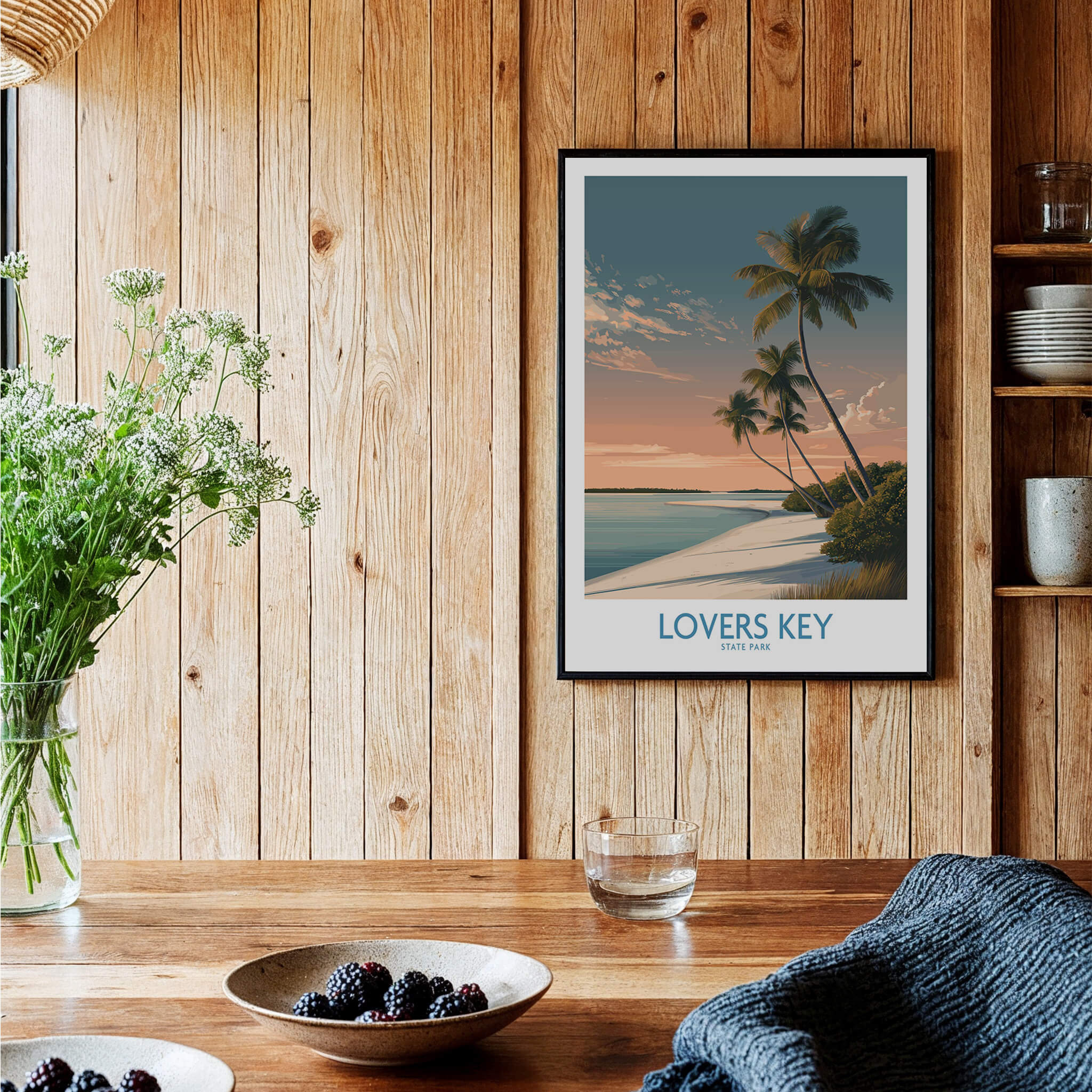 Lovers Key Canvas Print | Florida Gulf Coast Beach Poster displayed on a wooden wall near plants and dishes.