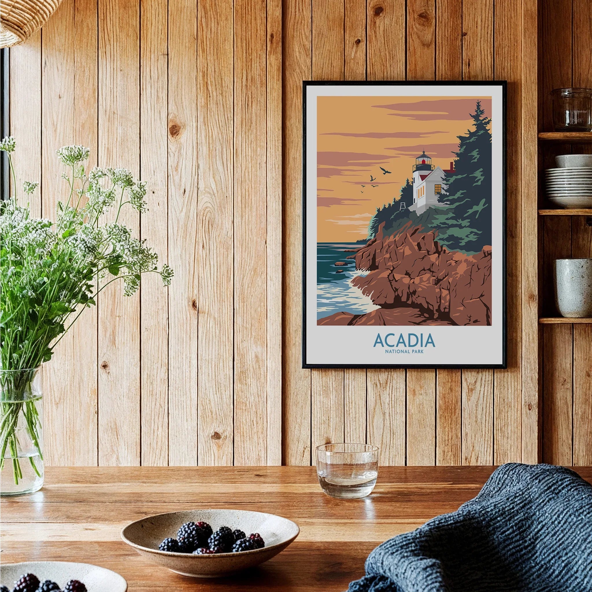 Framed Acadia National Park art print in rustic kitchen with wooden walls and fresh berries