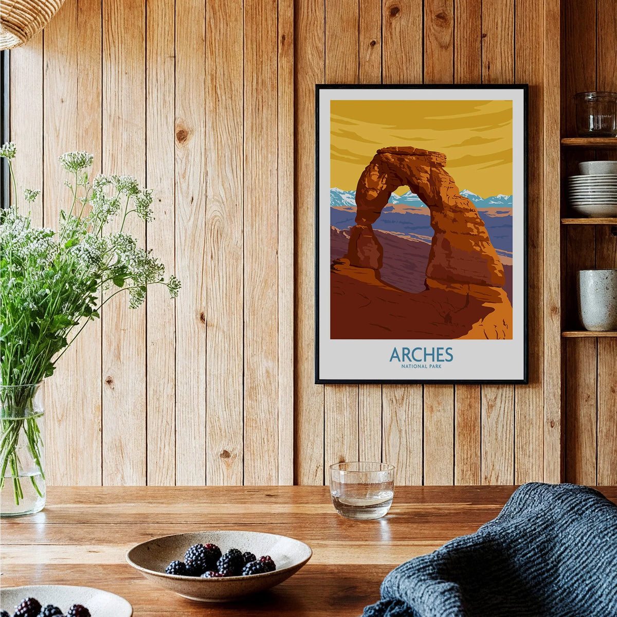 Arches National Park art print in black frame on wood kitchen wall, rustic decor setting