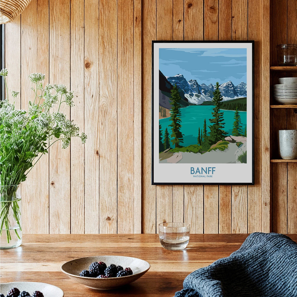 Banff National Park art print with mountains and lake, framed on wooden kitchen wall