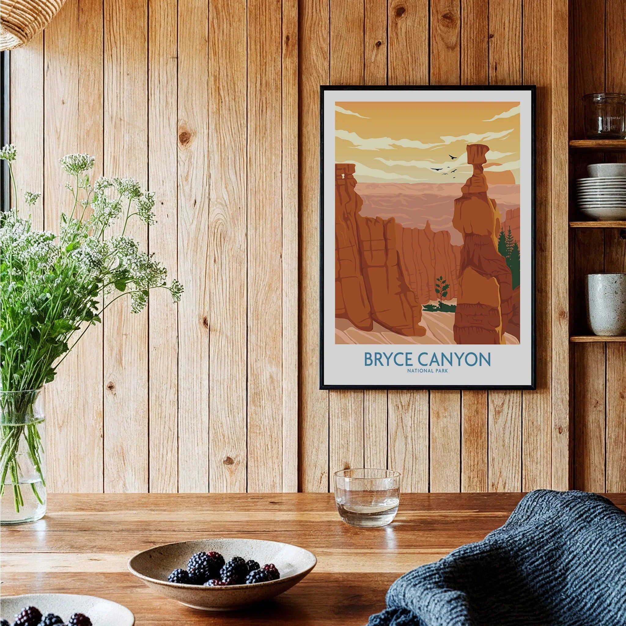 Bryce Canyon National Park art print in black frame hanging in a rustic wood kitchen setting.