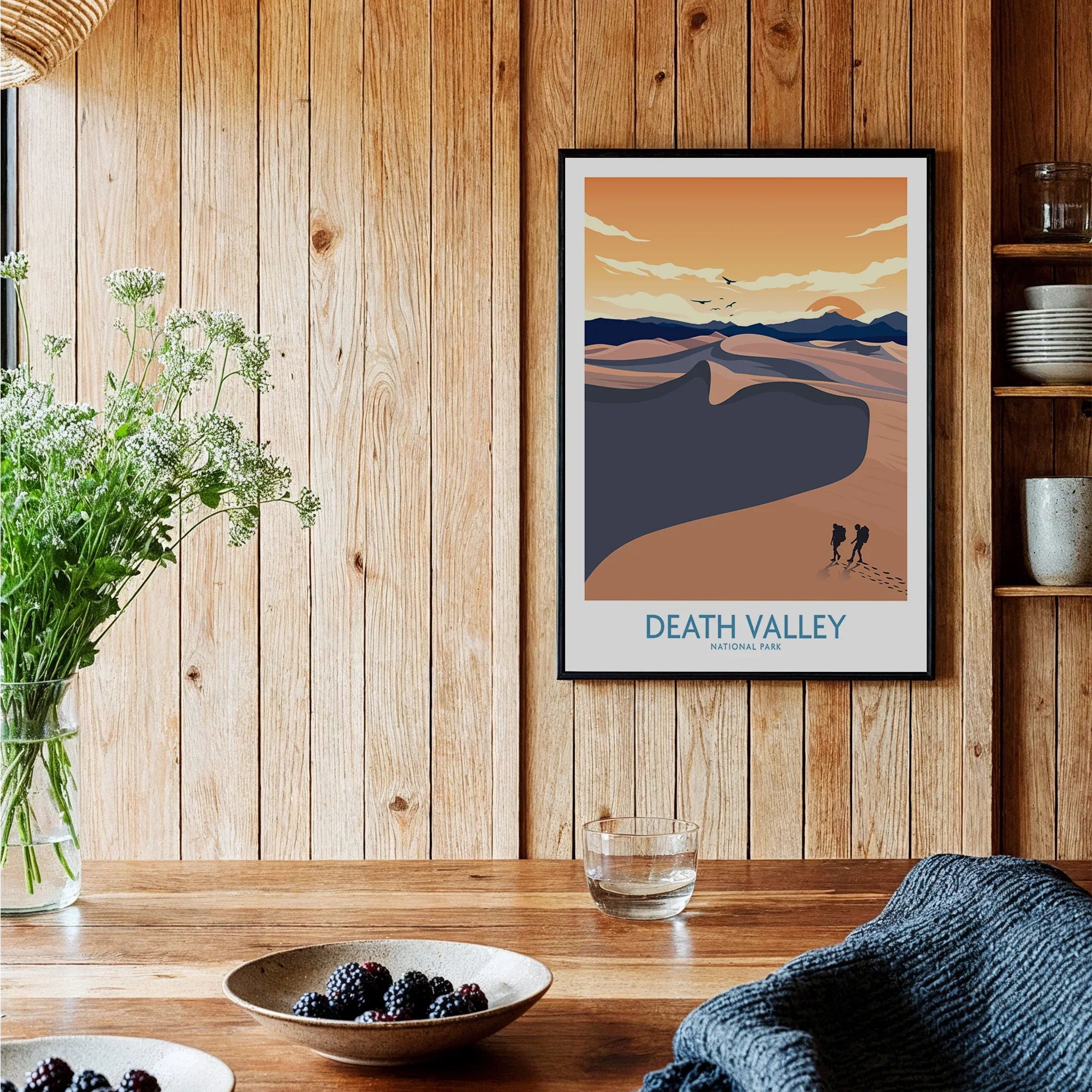 Framed Death Valley National Park art print on wood wall in cozy kitchen decor setting
