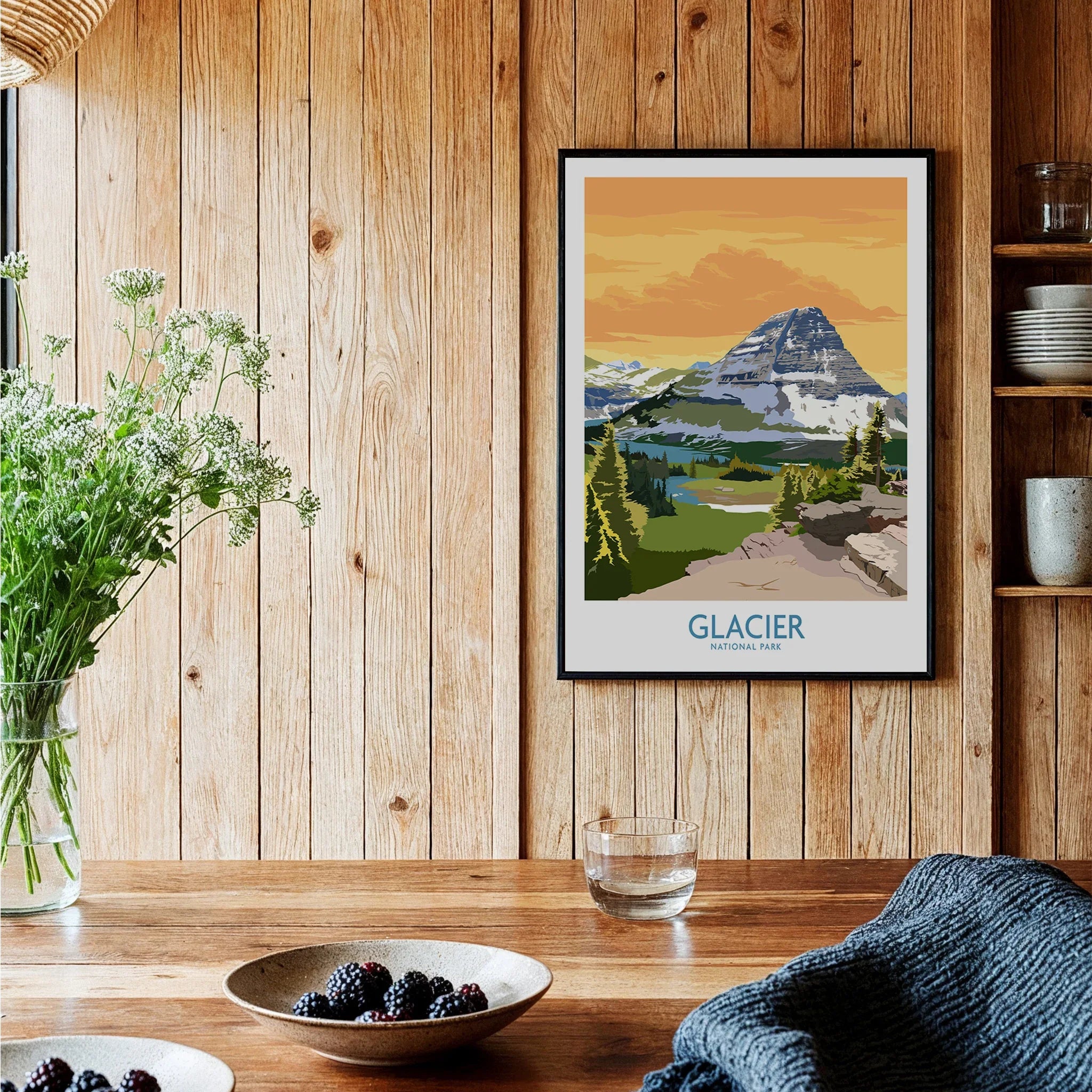 Glacier National Park art print in black frame displayed in rustic kitchen setting