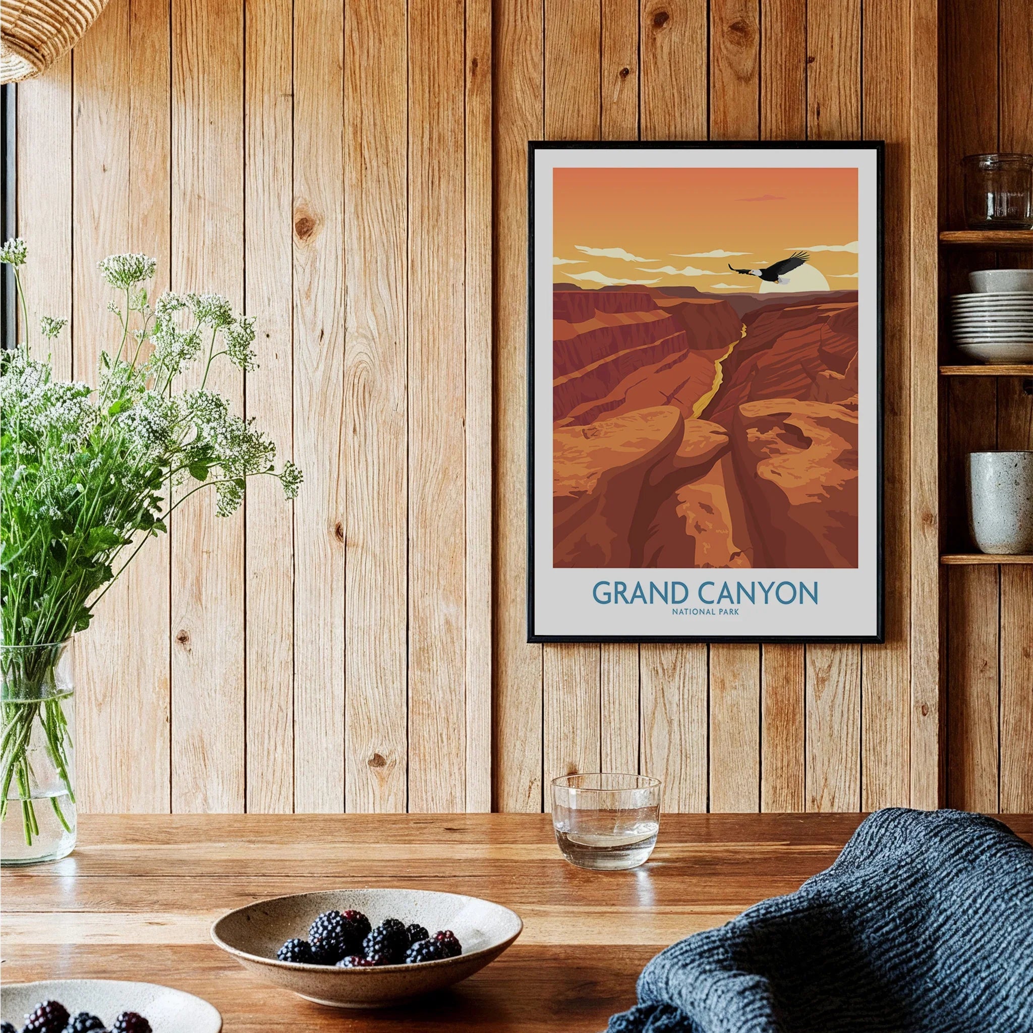 Framed Grand Canyon National Park art print hanging in a cozy wood kitchen setting