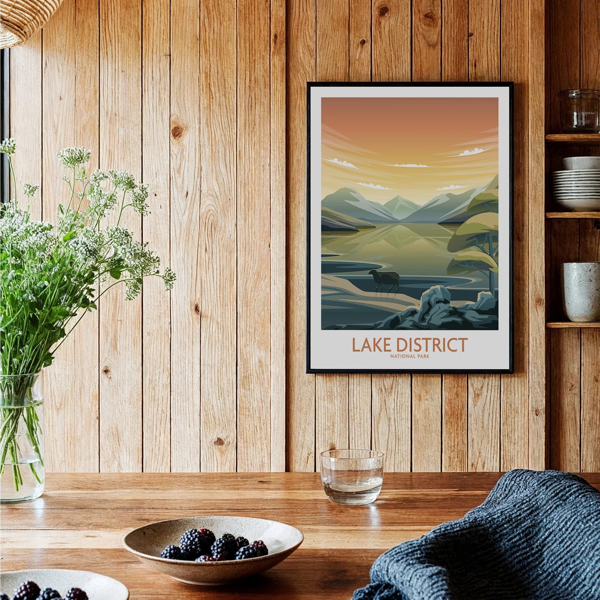 Lake District National Park art print with mountains and lake, framed on rustic kitchen wall