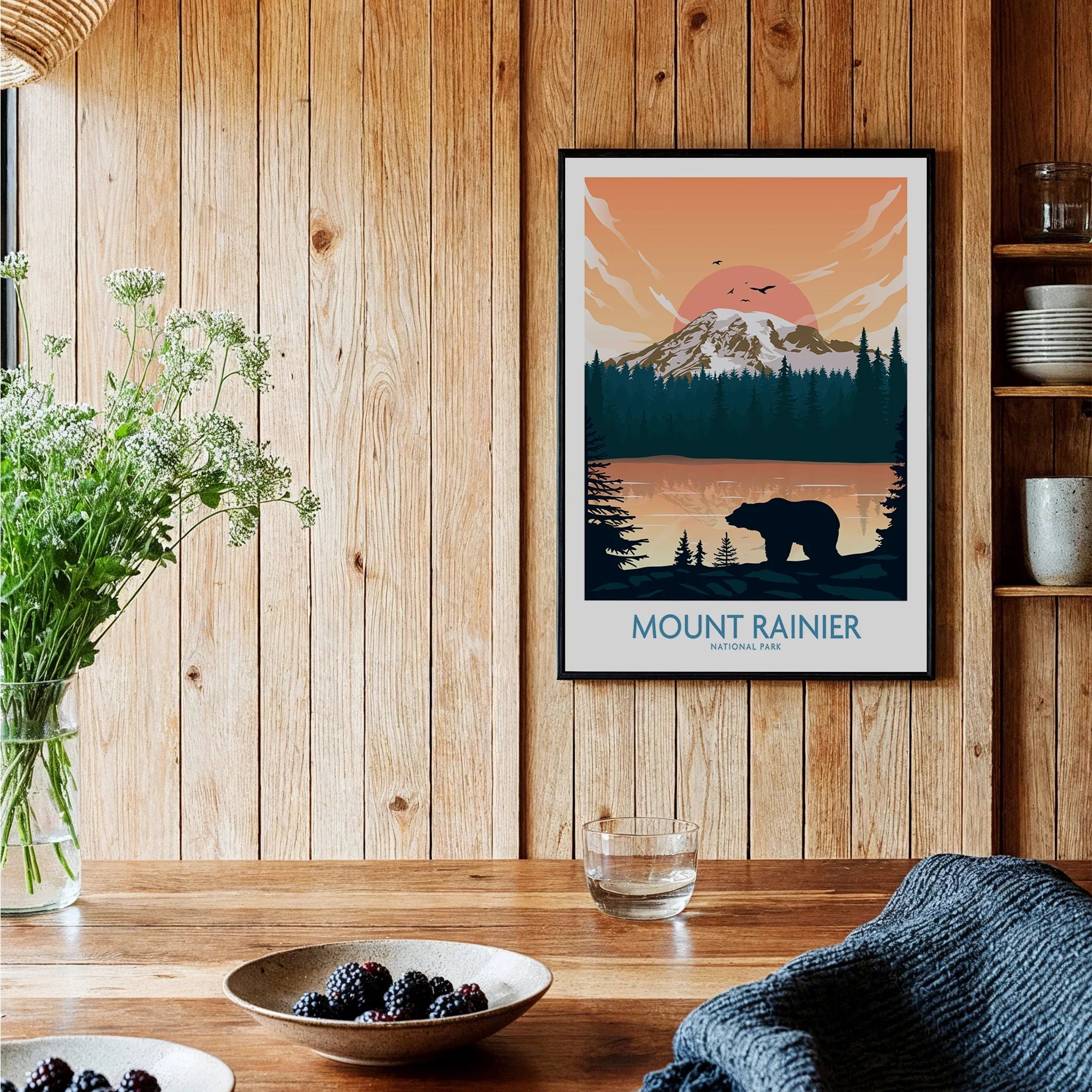 Framed Mount Rainier National Park art print hanging on a wooden kitchen wall