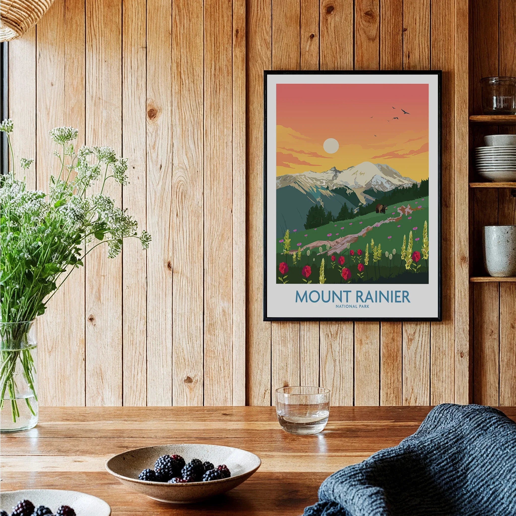 Mount Rainier National Park art print in black frame displayed in cozy wooden kitchen setting