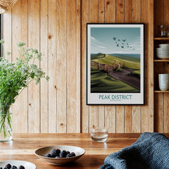 Peak District National Park art print in black frame on wooden kitchen wall, rustic decor