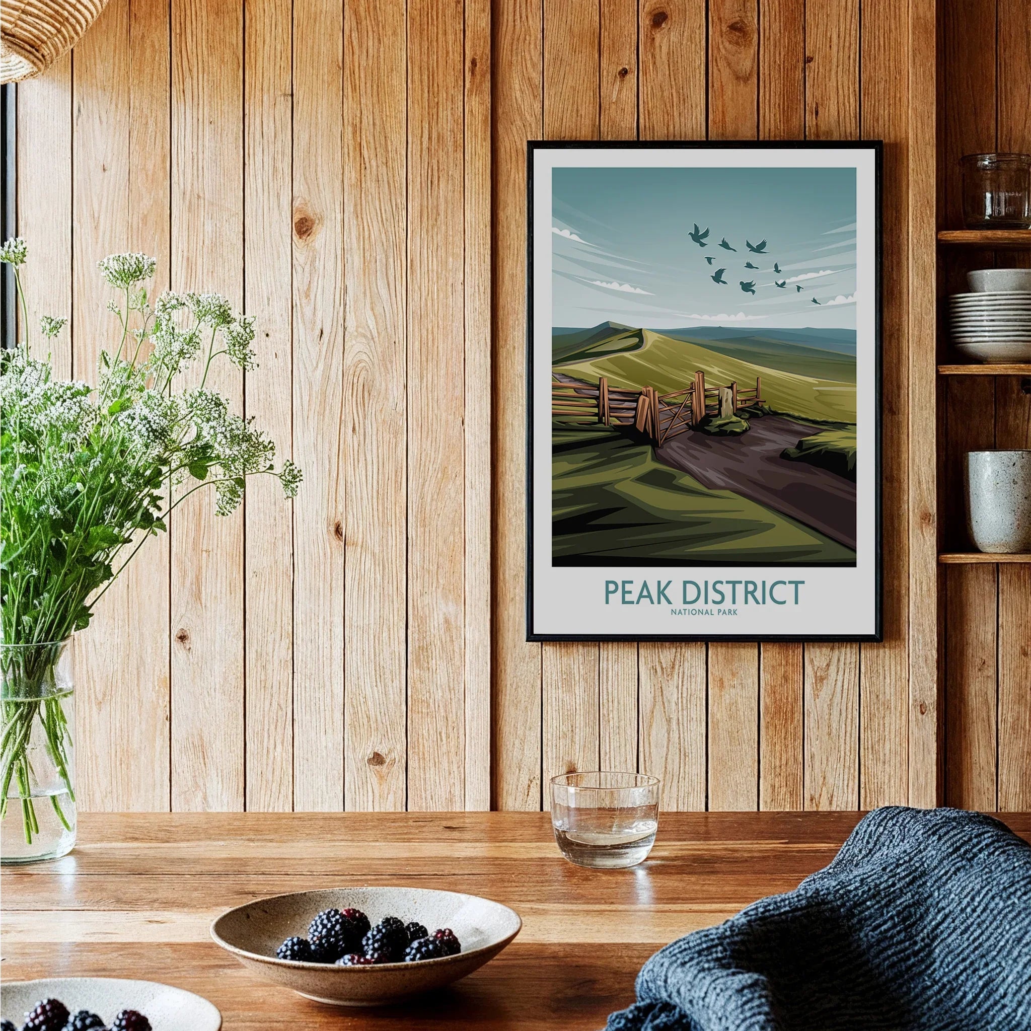 Peak District National Park art print in black frame on wooden kitchen wall, rustic decor