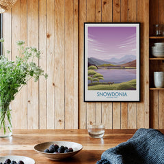 Snowdonia National Park art print with mountains and lake, framed on a rustic kitchen wall