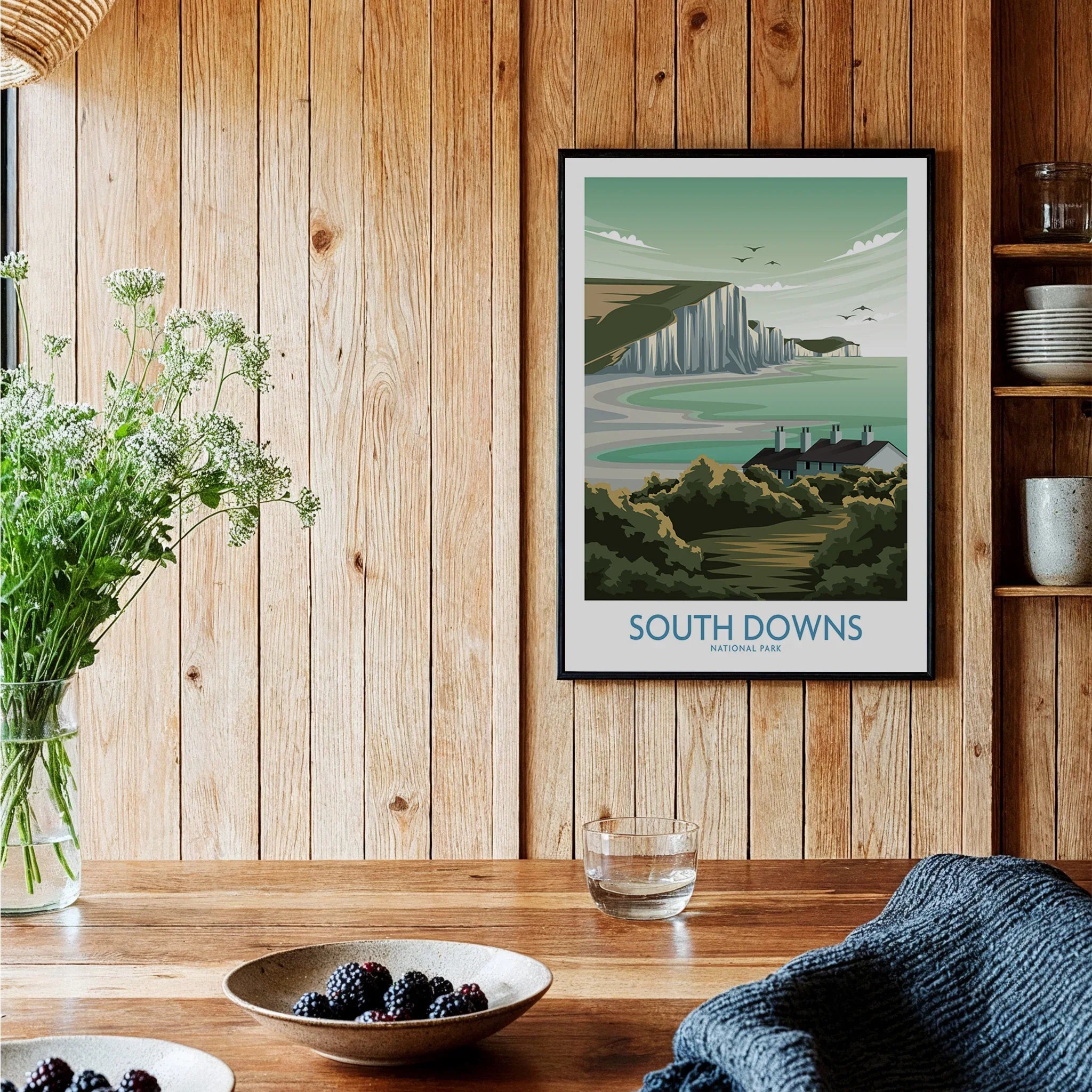 South Downs National Park art print in black frame on wood wall in modern kitchen setting