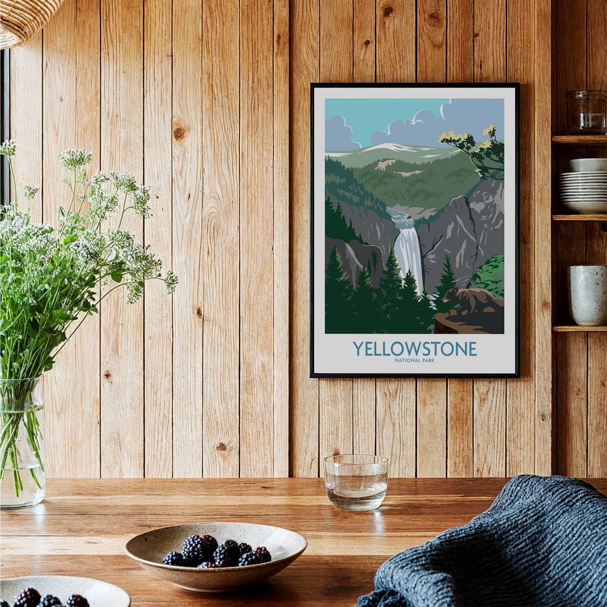 Yellowstone National Park art print with waterfall, framed on rustic wood kitchen wall