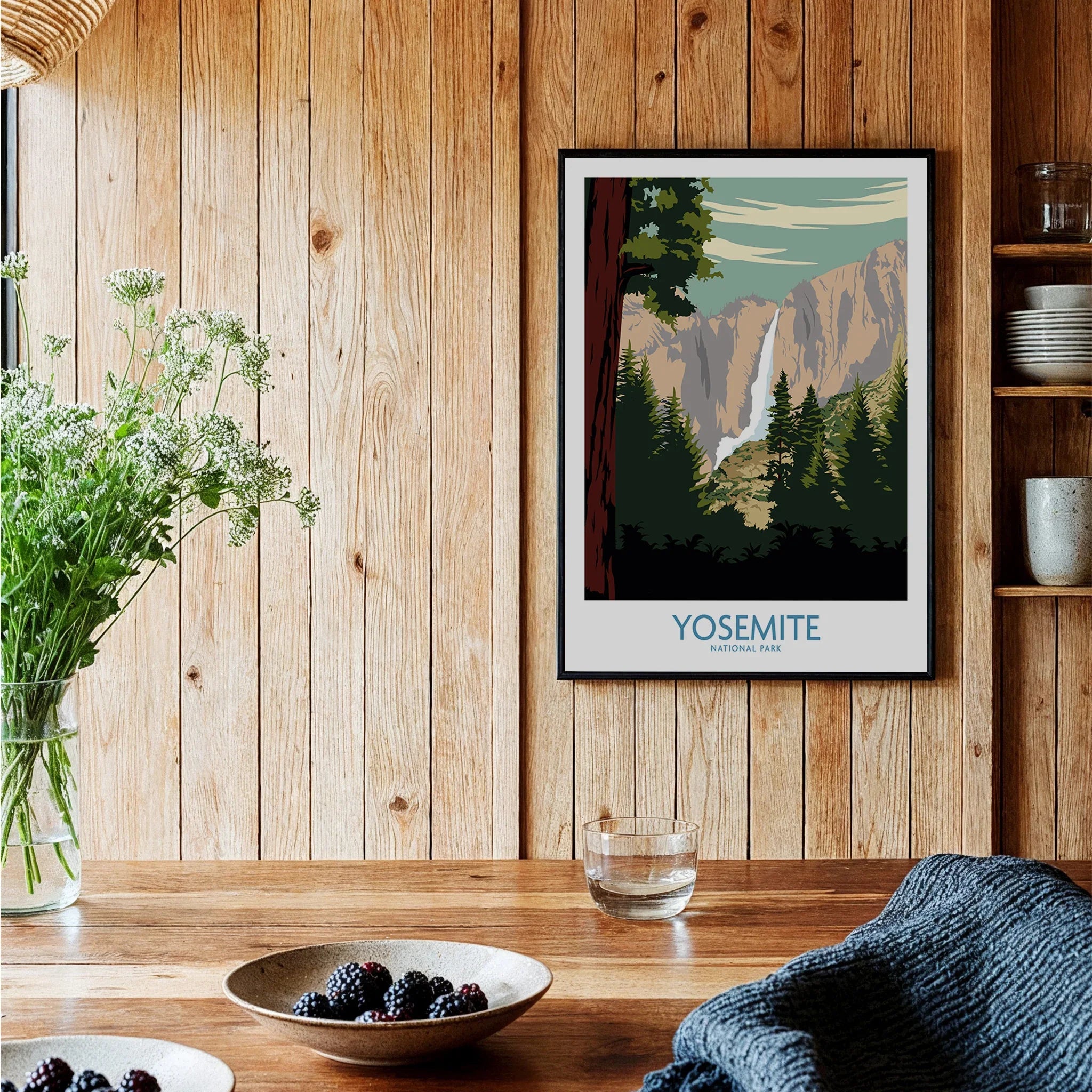 Yosemite National Park art print in black frame hanging in rustic kitchen setting