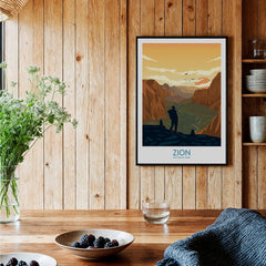 Framed Zion National Park art print on wood wall in rustic kitchen with bowls of berries