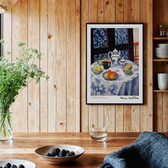 Matisse Art Prints - Still Life Blue Tablecloth Poster featuring a table set with fruit and teapot against a dark background.