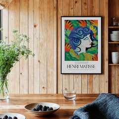 Matisse Art Prints - Woman with Flowers Abstract Art Print displayed in a cozy wooden interior with plants and bowls.
