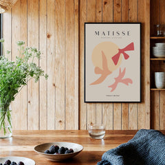 Matisse Art Prints - Abstract Birds Sun Shapes Poster displayed in a cozy interior with wooden accents.