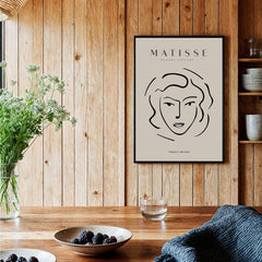 Matisse Art Prints - Abstract Line Face Drawing featuring minimalist line art of a woman's profile against a beige background.