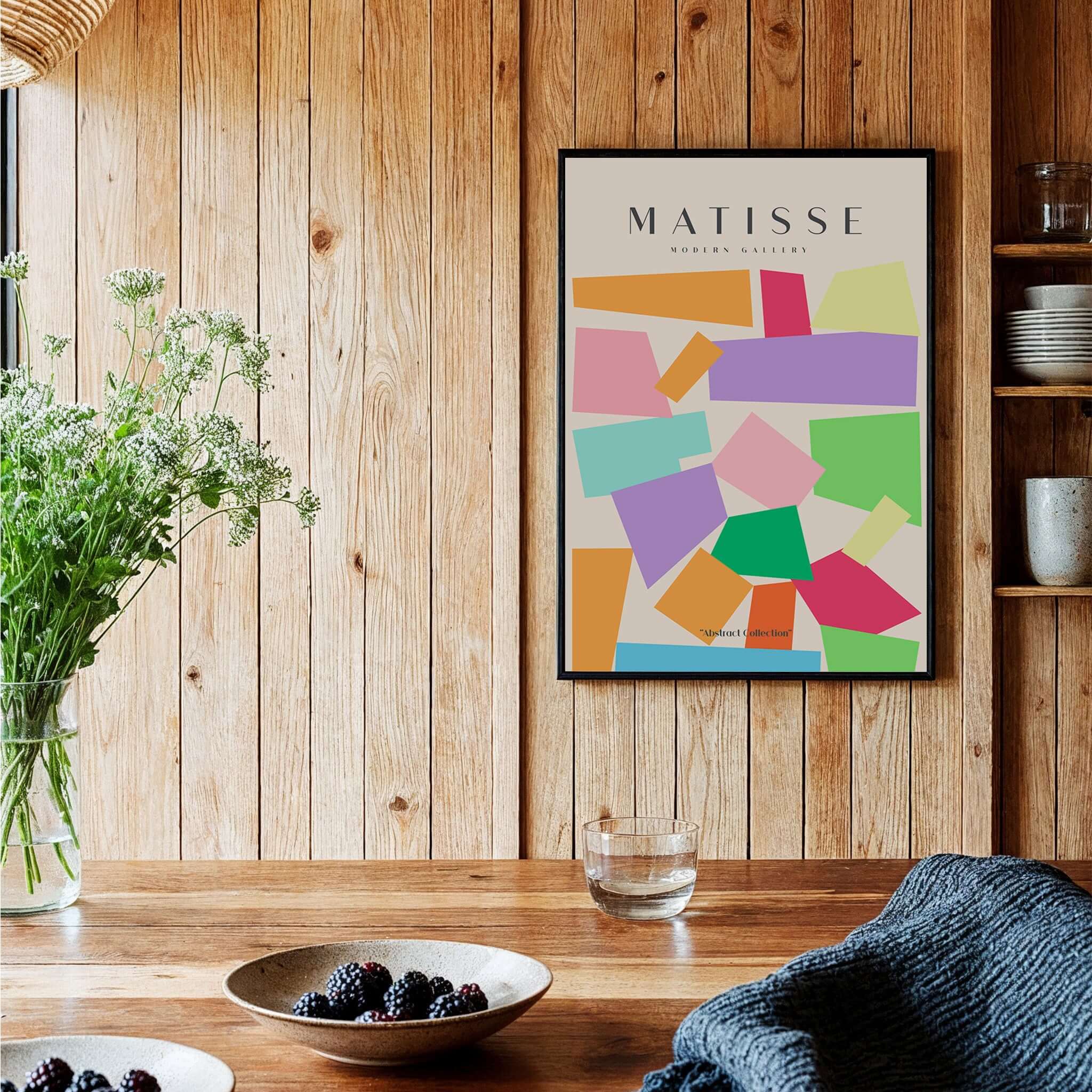 Matisse Art Prints - Colorful Geometric Shapes Abstract Print displayed on a wooden wall, adding vibrant decor to a cozy setting.