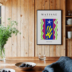 Matisse Art Prints - Jazz Abstract Star Hand Waves Poster displayed in a cozy dining area with wooden decor.