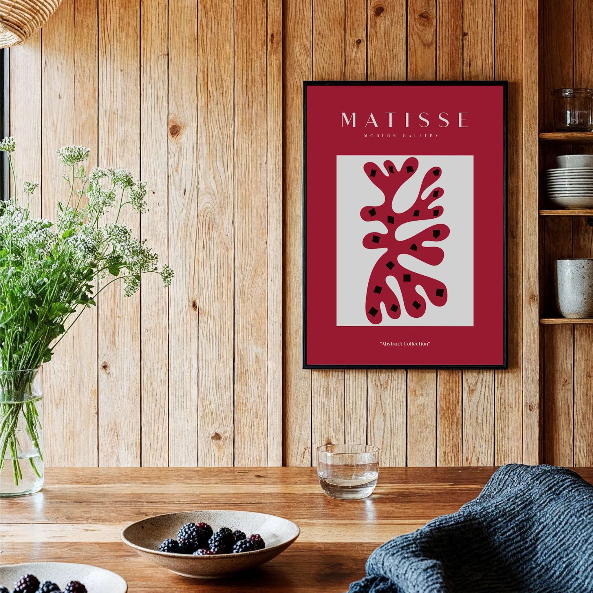 Matisse Art Prints - Red Coral Abstract Black Diamonds Poster displayed in a stylish interior with wooden decor.