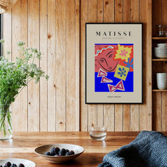 Matisse Art Prints - Abstract Face with Flowers Collage Wall Art displayed in a rustic wooden setting.