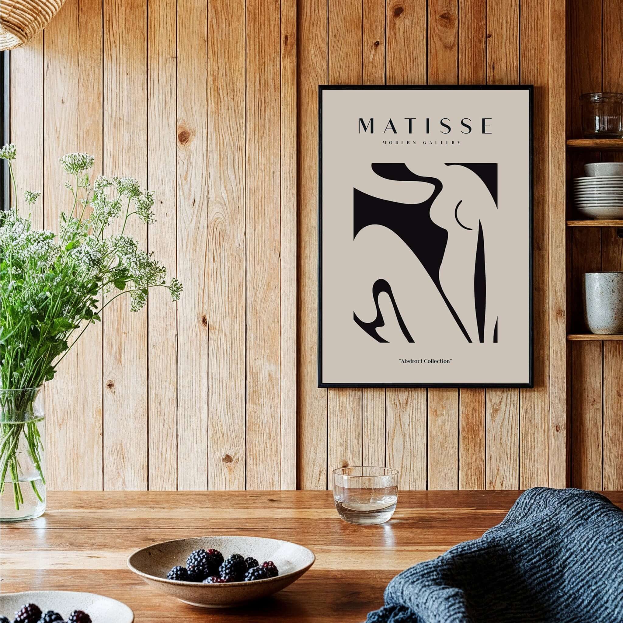 Matisse Art Prints - Black Abstract Nude Figure Poster displayed in a stylish kitchen setting with wooden accents.