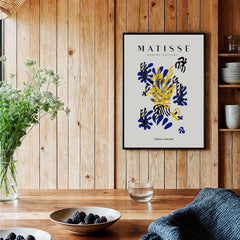 Matisse Art Prints -  Abstract Floral Blue Yellow Black Poster displayed in a stylish interior with wooden decor.
