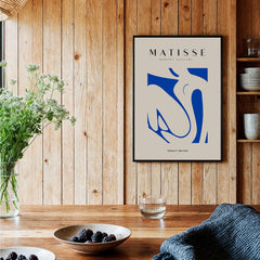 Matisse Art Prints - Blue Nude Abstract Cut Out Wall Art showcasing a blue nude figure framed in a stylish interior setting.