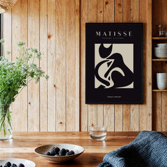 Matisse Art Prints - Black Beige Abstract Composition Poster displayed in a wooden interior with plants and table.