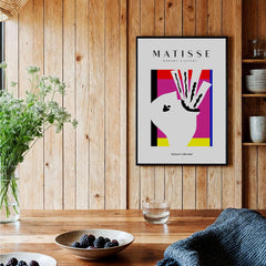 Matisse Art Prints -Abstract Head  Jazz Series Colorful Blocks Wall Art displayed in a rustic setting with a wooden wall.