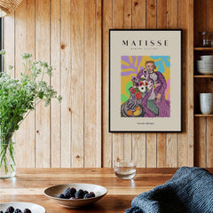 Matisse Art Prints - Stylized Woman with Flowers Fruit Still Life Interior Poster framed in a cozy interior setting.