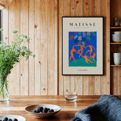Matisse Art Prints - The Dance Figures Abstract Sky Poster displayed in a serene interior setting with wooden decor.