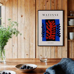 Matisse Art Prints -  Red Coral Black Leaves Blue Frame Poster displayed in a modern home setting.