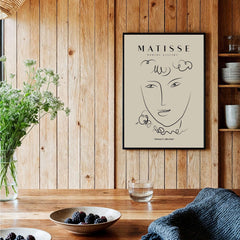 Matisse Art Prints -  Line Art Face Curly Hair Minimalist Poster displayed in a cozy interior setting.