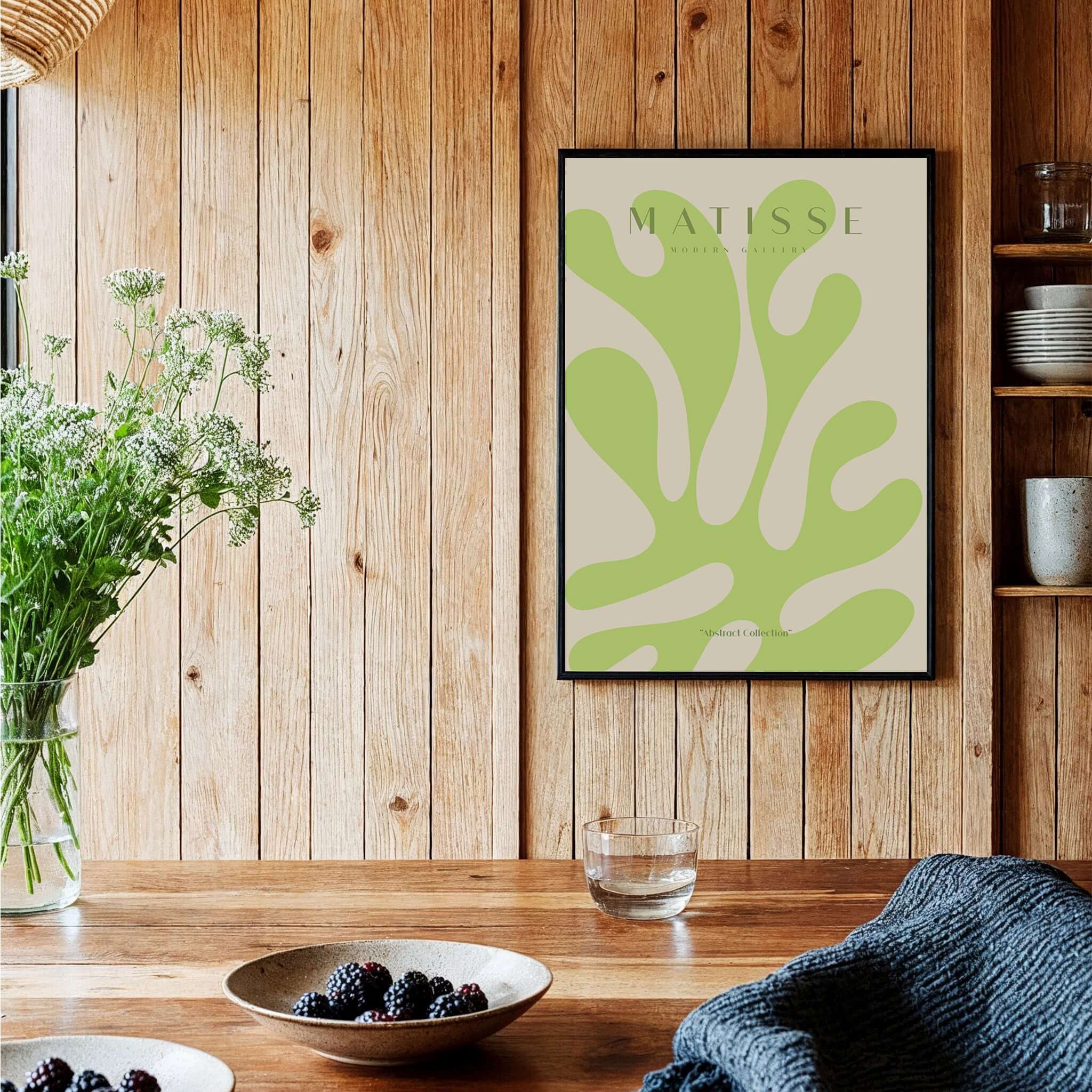 Matisse Art Prints - Lime Green Abstract Coral Shape Poster displayed on wooden wall with plants and decor.