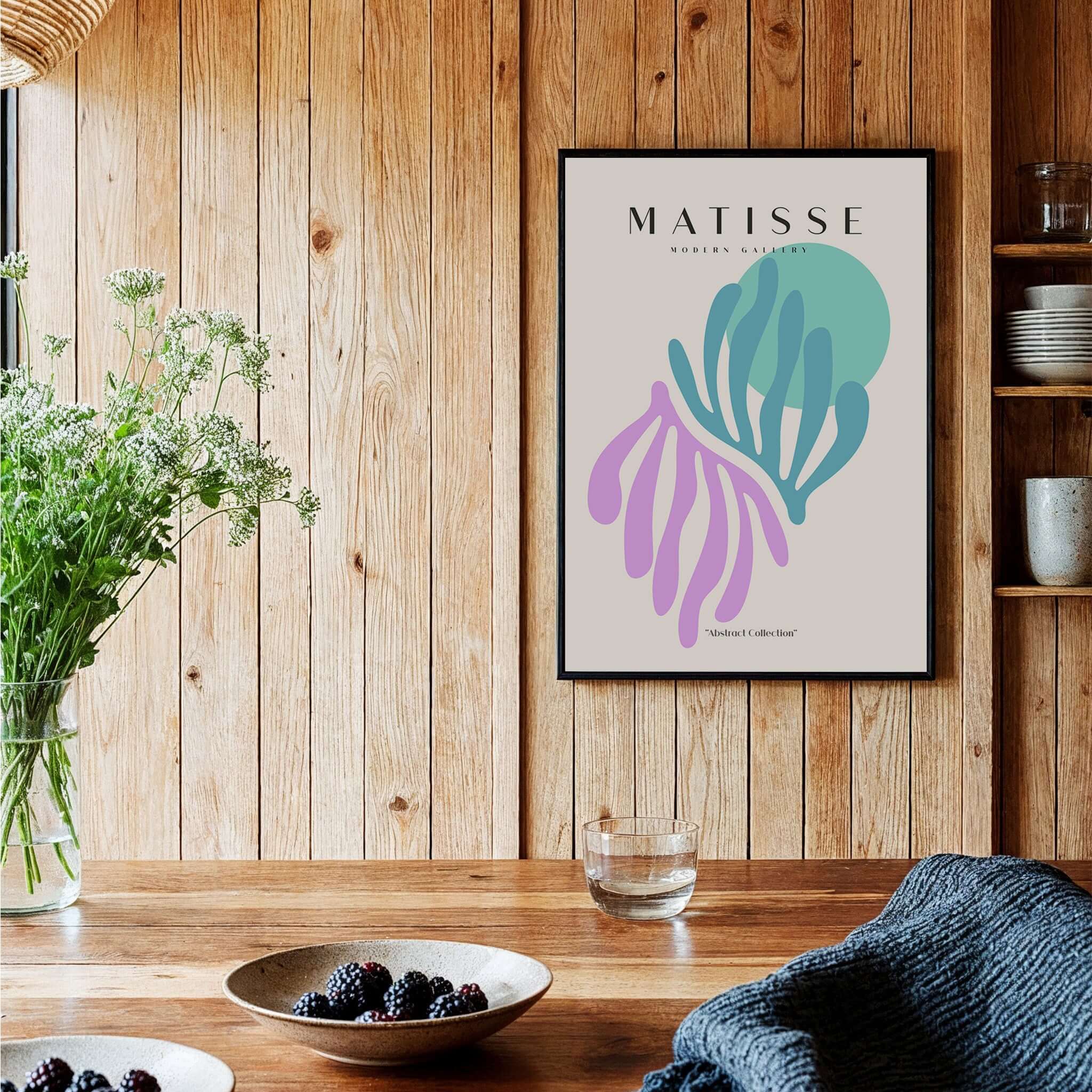 Matisse Art Prints -Teal Pink Abstract Leaves Sun Poster displayed in a wooden interior with a flower vase and decorative items.